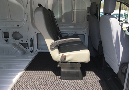 interior of white van with one row of seats