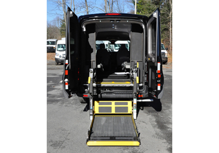 black van with opened back and lowered platform