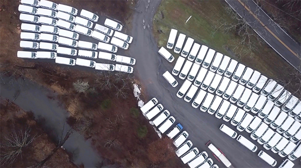 aerial image of parked white vans